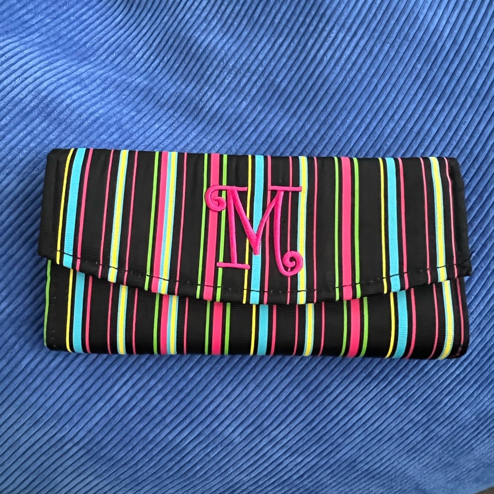 Colorful striped travel jewelry case with M monogram